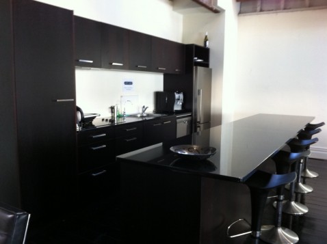 The sleek modern high-end glossy black furniture at Loft503